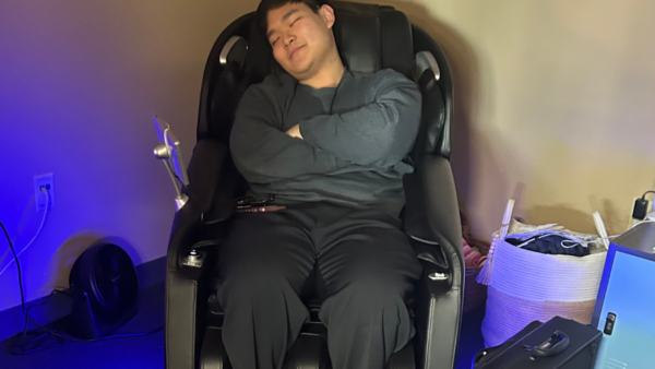 Man sitting in zen zone massage chair.