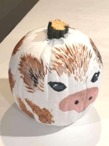 pumpkin painted to look like cow face