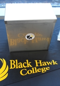 time capsule & college pennant on table