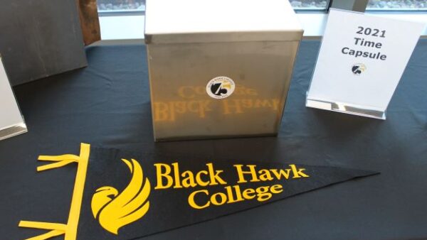 time capsule, college pennant & sign on table