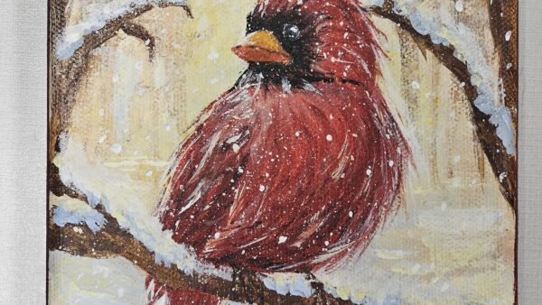 painting of bright red cardinal sitting on a snowy tree branch