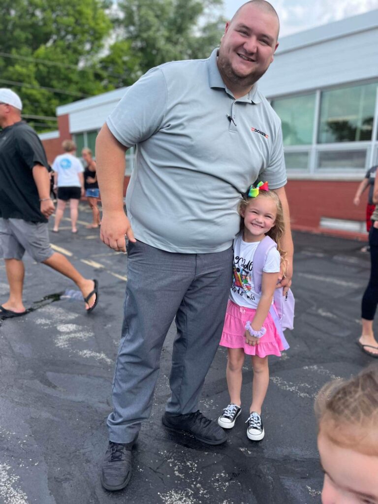 Nick after graduation with his daughter