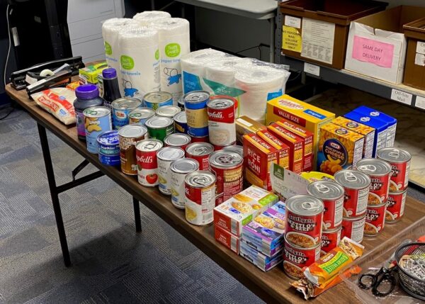 table covered with food and hygiene items