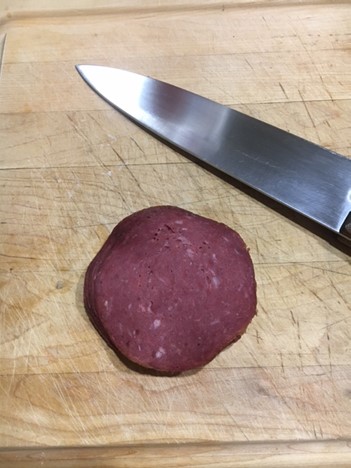 Chipped beef with knife.