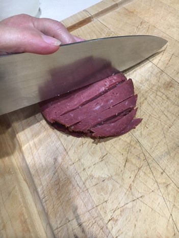 Cuting chipped beef with knife