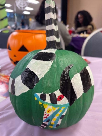 pumpkin painted to look like sandworm from Beetlejuice movie