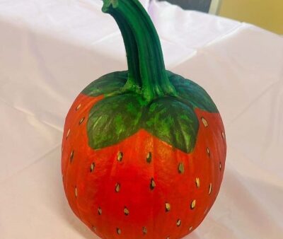 pumpkin painted to look like a strawberry