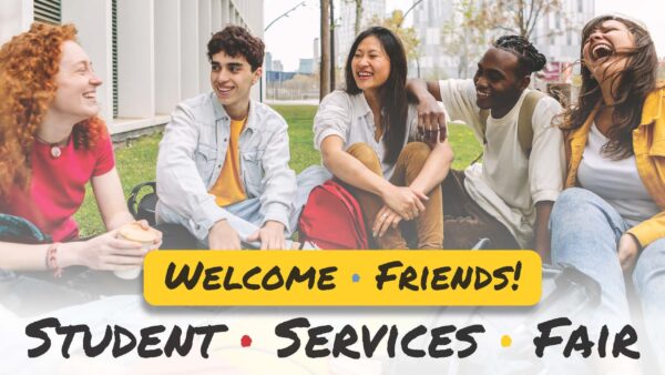 5 people sitting outdoors on the ground smiling & laughing with text in foreground -- Welcome friends student services fair