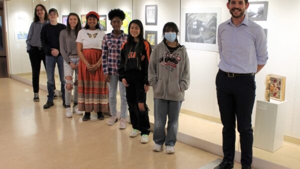 8 people standing in front of ArtSpace Gallery