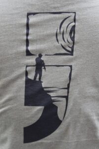 back of T-shirt with semicolon and outline of soldier