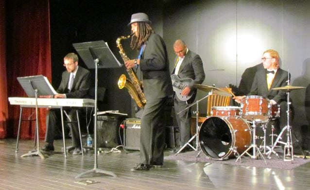 jazz musicians on keyboards, sax, guitar & drums