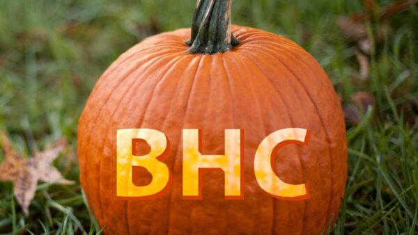 pumpkin on grass with letters BHC on it