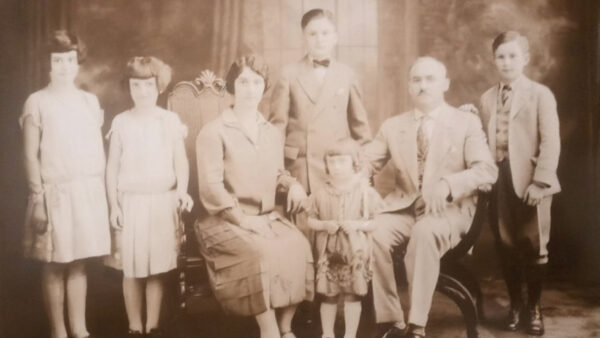 early 1900s sepia tone photo of Peter & Helen Watson with their 5 children