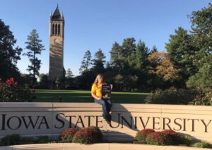 Student at Iowa State University holding sign that says Black Hawk College got me here