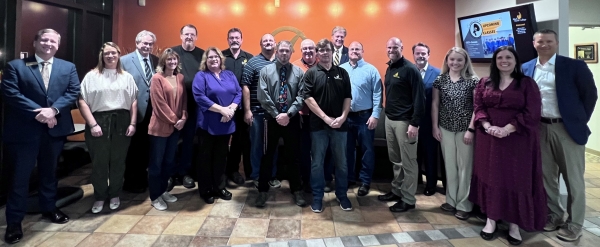 18 people standing in lobby of Community Education Center in Kewanee