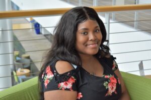 BHC student Chiquita White sitting on green chair