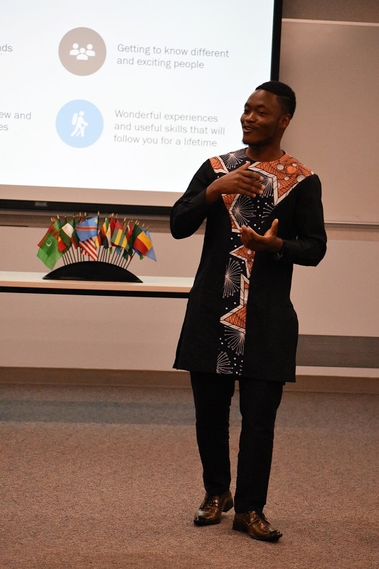 male student speaking during a meeting