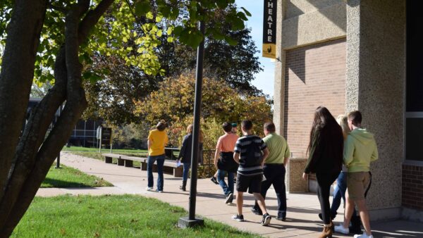 students on tour of QC Campus outside Building 1