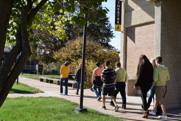 students on tour of QC Campus outside Building 1