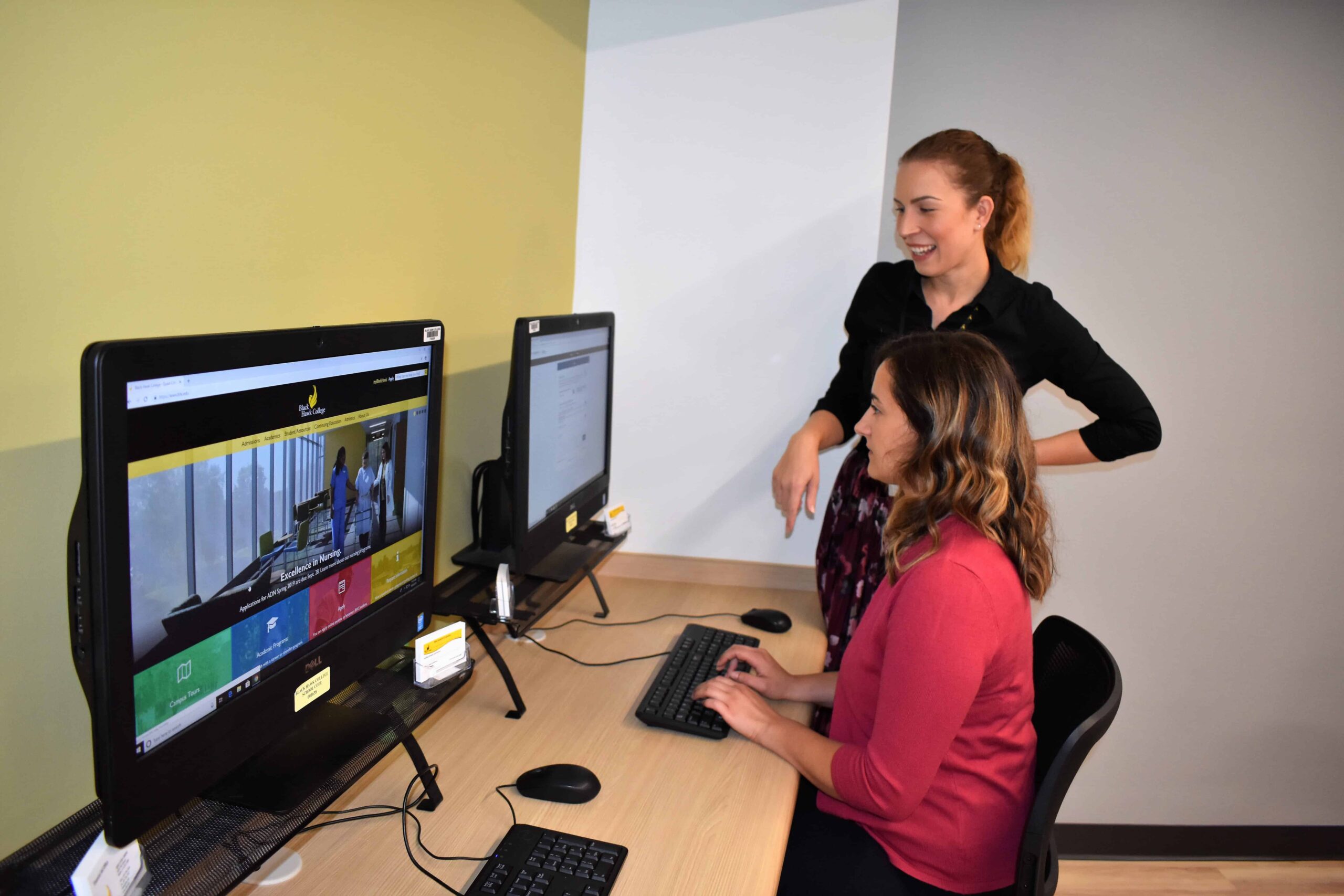 two women workin gon computers