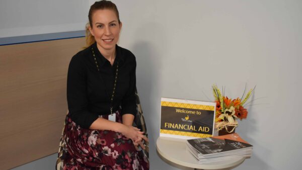 Financial Aid director sitting at table in Financial Aid office