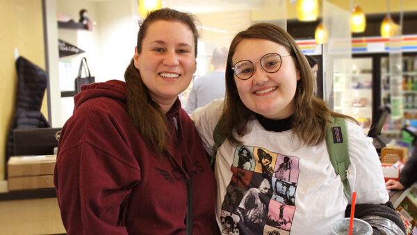 Mother and daughter pose for a photo in the Black Hawk Bookstore.