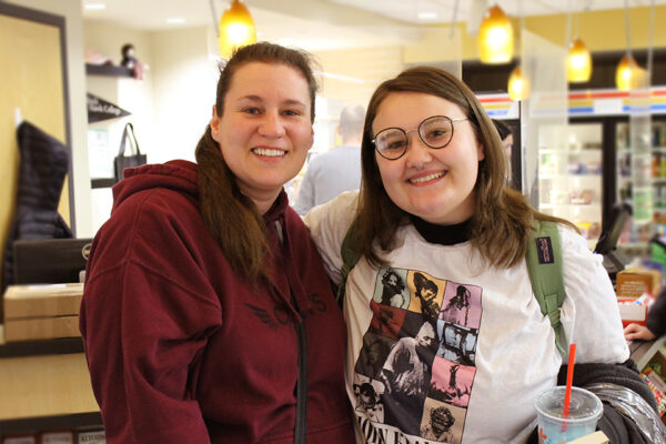 Mother and daughter pose for a photo in the Black Hawk Bookstore.