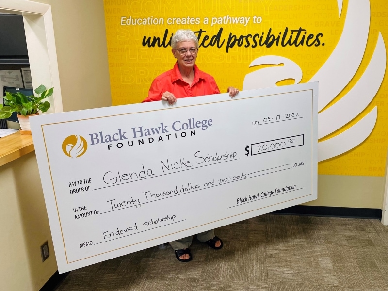 Glenda Nicke holding oversized check