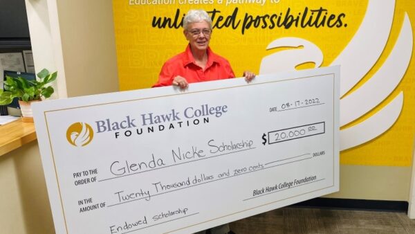 Glenda Nicke holding oversized check