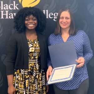 Akos Tiwa & Mary Beth Stopoulous holding certificate