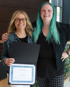 Amy Smith holding certificate with student Lauren Bloomquist