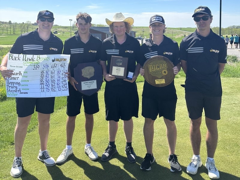 5 golfers standing on golf course with awards