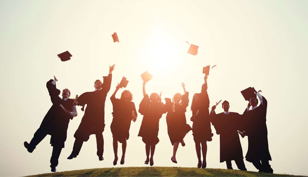 Grads throwing caps in the air