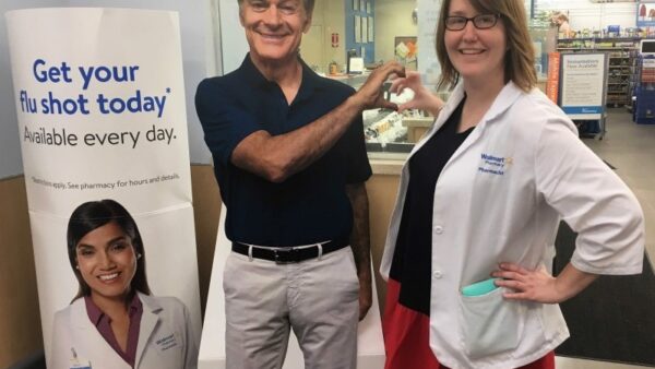 pharmacist posing with cutout of dr. oz