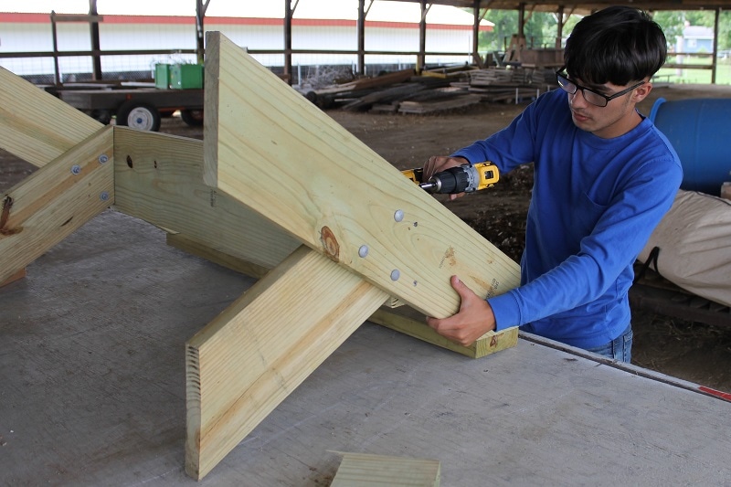 man works on a carpentry project