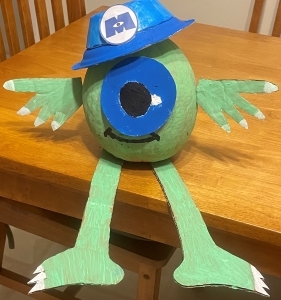 pumpkin painted to look like Mike from Monsters Inc.