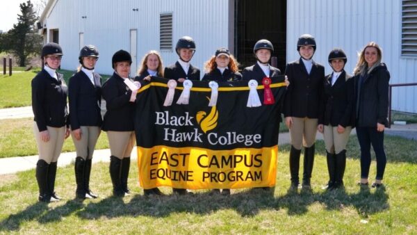 East campus equestrian riders holding BHC banner