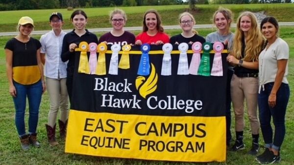 East campus equestrian riders holding BHC banner