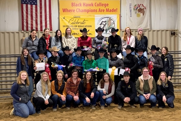 30 Western Equestrian Team members in arena