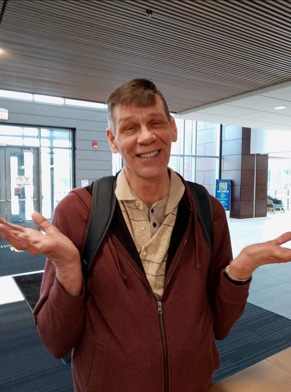 student in the lobby of Building 1