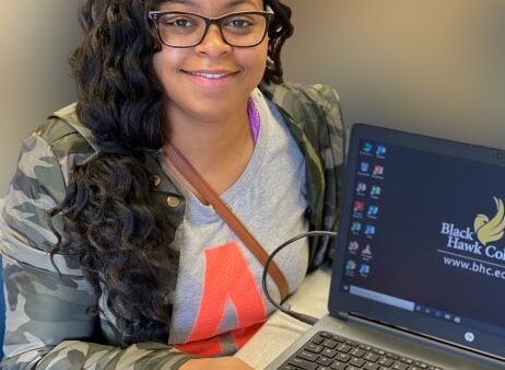 smiling student with laptop