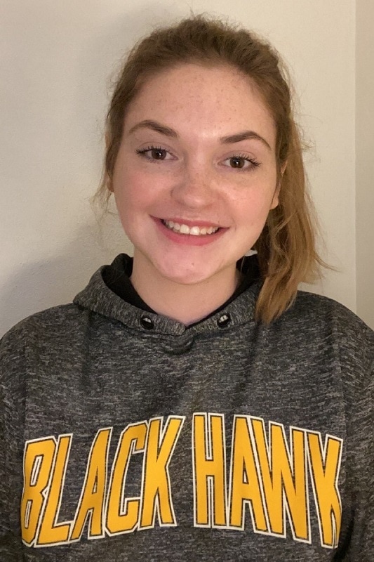 smiling female student in a Black Hawk College hoodie