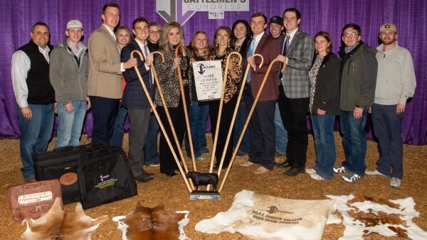 16 people standing with variety of awards