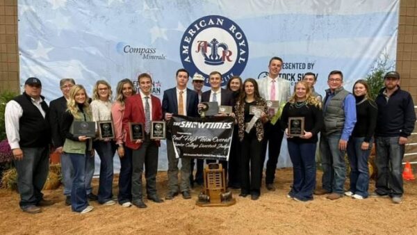 17 people standing with awards