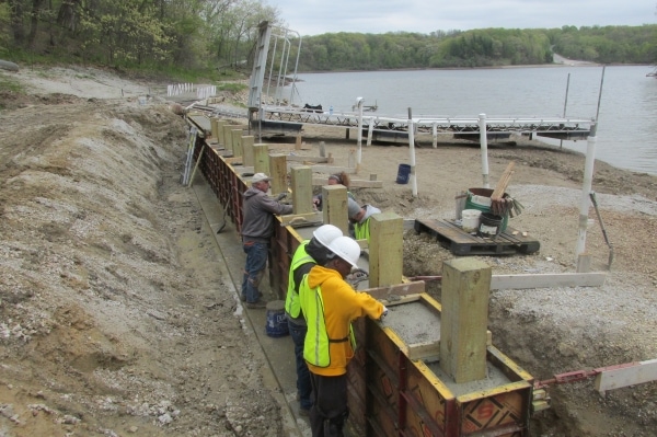 people building retaining wall at Lake George