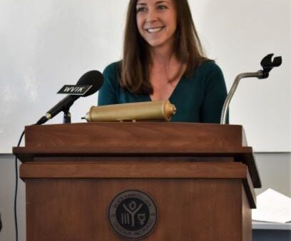 Maria Ontiveros speaking at podium