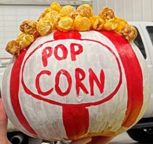 pumpkin painted to look like box of popcorn