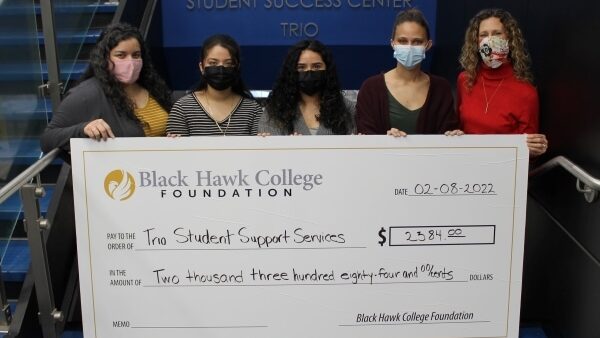 5 people holding oversized check