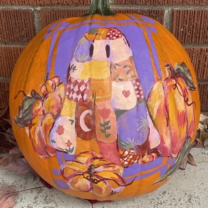 pumpkin with quilt ghost and pumpkins painted on it