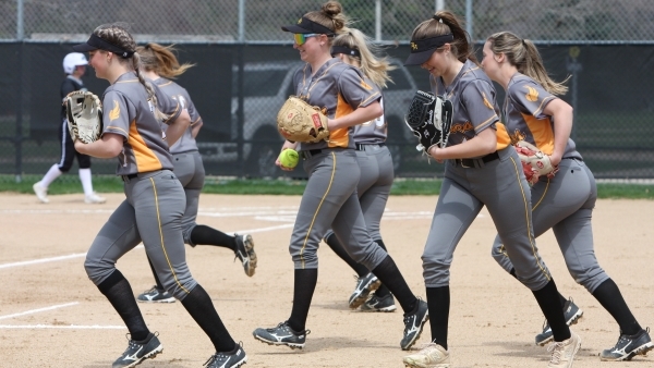 softball players running across diamond